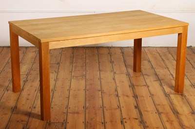 Lot 382 - A modern oak rectangular dining table, on...