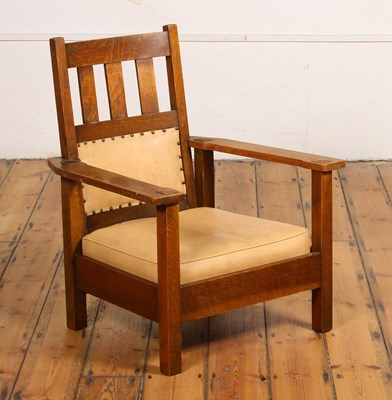 Lot 18 - An Arts & Crafts Mission style oak armchair,...