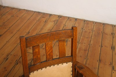 Lot 18 - An Arts & Crafts Mission style oak armchair,...