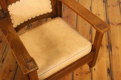 Lot 18 - An Arts & Crafts Mission style oak armchair,...