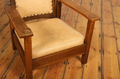 Lot 18 - An Arts & Crafts Mission style oak armchair,...