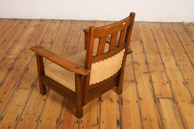 Lot 18 - An Arts & Crafts Mission style oak armchair,...
