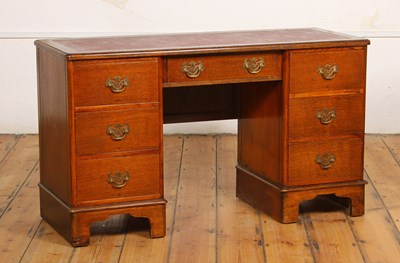 Lot 689 - An early 20th century oak pedestal desk,...