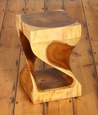 Lot 732 - An Indonesian carved teak stool, of curved...