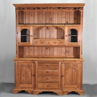 Lot 395 - A carved pine breakfront dresser