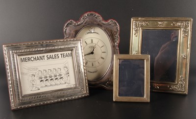Lot 400 - A silver-framed mantel clock, together with a...