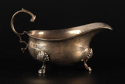 Lot 96 - A George V silver sauce boat, of helmet shape,...
