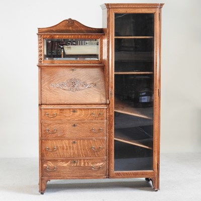 Lot 525 - An early 20th century oak Green Man bureau...