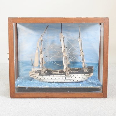 Lot 41 - A diorama of a three masted ship at sea, in a...