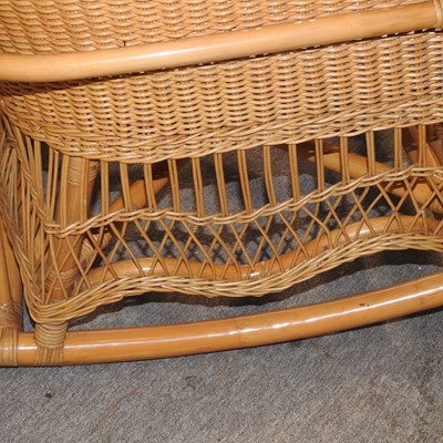 Lot 87 - A 20th century wicker rocking chair