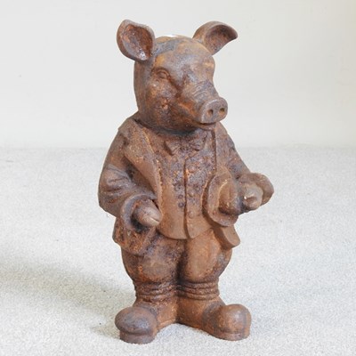 Lot 611 - A cast metal garden statue of a pig, 44cm high
