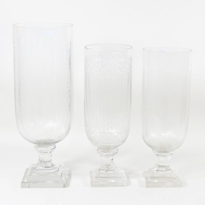Lot 441 - A glass storm lantern, 40cm high, together...