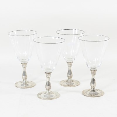 Lot 245 - A set of four glass wine glasses, stamped...