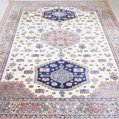Lot 499 - A Persian kirman rug, with three central...