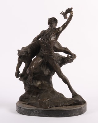 Lot 34 - A bronze figure of a man fighting a tiger, on...