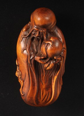 Lot 485 - A small Chinese carved wood figure of a man