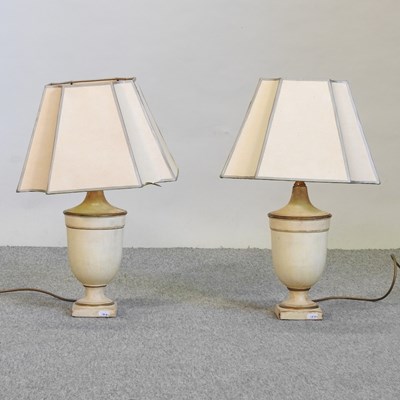 Lot 653 - A pair of cream painted table lamps and shades