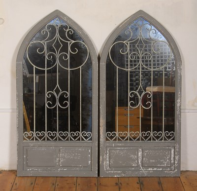 Lot 671 - A pair of grey painted garden mirrors of...