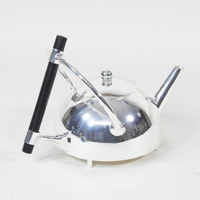 Lot 652 - A plated teapot, in the style of Christopher...
