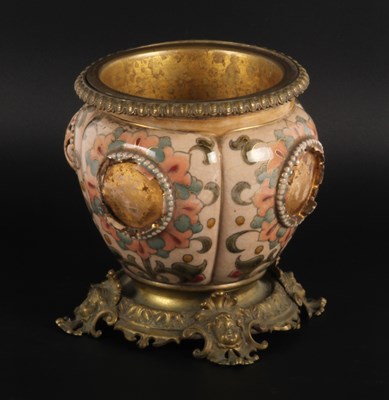 Lot 479 - A gilt metal and pottery jardiniere
