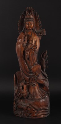 Lot 393 - A Chinese carved wooden statue of Guanyin