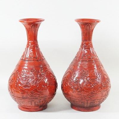 Lot 291 - A pair of Chinese red glazed porcelain vases,...