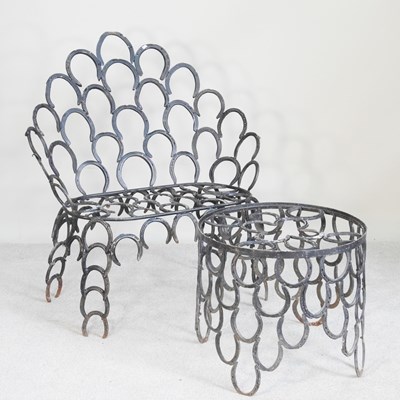 Lot 40 - A garden seat and matching table, made from...
