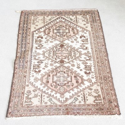 Lot 297 - A Turkish rug, with hooked medallions, on a...