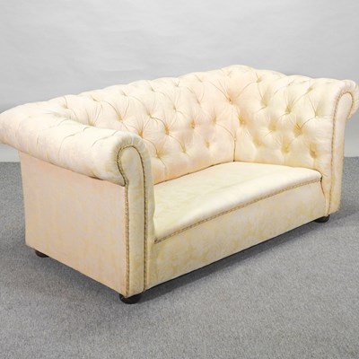 Lot 265 - A 1920's cream upholstered chesterfield sofa