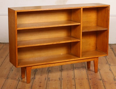 Lot 567 - A 20th century oak open bookcase, on tapered legs