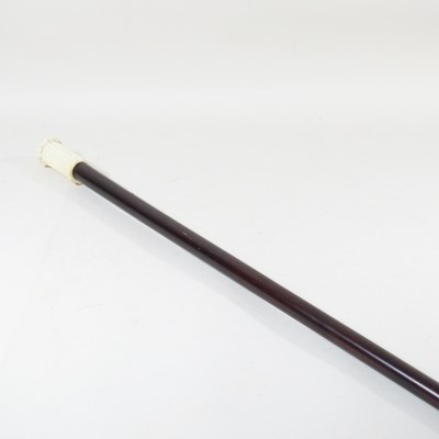 Lot 578 - A walking cane, with a carved bone handle