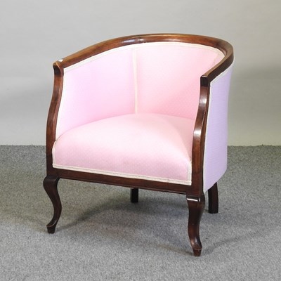 Lot 673 - An Edwardian pink upholstered tub shaped armchair