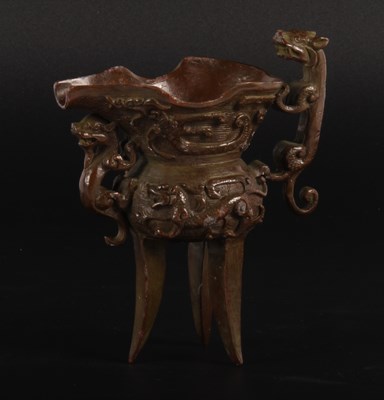 Lot 78 - A Chinese bronze libation cup, having a...