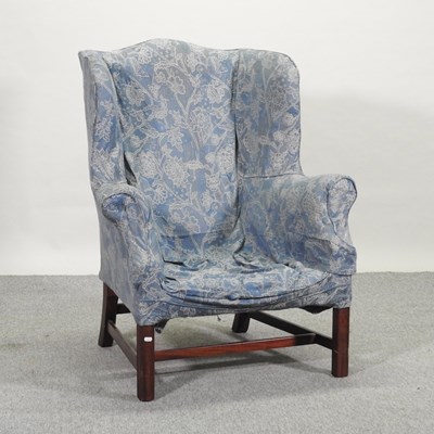 Lot 516 - A 19th century style mahogany wing back armchair