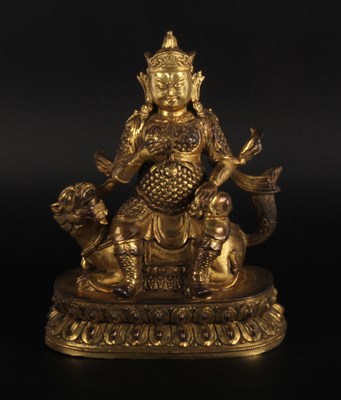 Lot 142 - A Chinese gilt bronze figure of a deity, shown...
