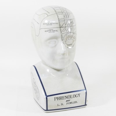 Lot 369 - A glazed ceramic phrenology head, 28cm high