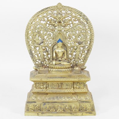Lot 428 - A Nepalese bronze statue of seated Buddha,...