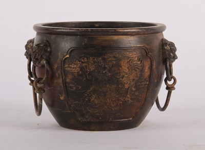 Lot 244 - A Chinese bronze bowl, relief decorated with...