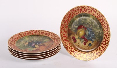 Lot 818 - A set of six porcelain plates, decorated with...
