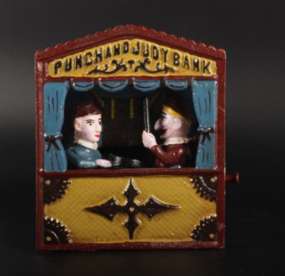 Lot 514 - A painted cast iron Punch & Judy novelty money...