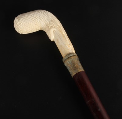 Lot 441 - A carved bone handled walking stick
