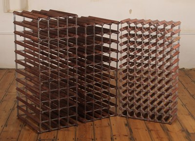 Lot 656 - A set of three wooden wall-mounted open wine...