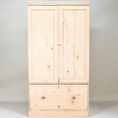Lot 380 - A 19th century stripped pine wardrobe, with a...