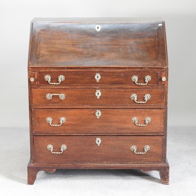 Lot 533 - A George III mahogany bureau, on bracket feet