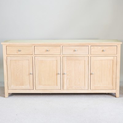 Lot 493 - A modern Cotswold light oak sideboard