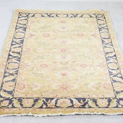 Lot 366 - A modern Indian woollen carpet, with scrolling...