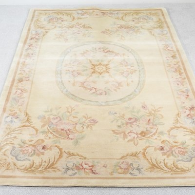 Lot 543 - An Aubusson style rug, with pale floral...