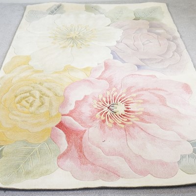 Lot 270 - A modern rug, decorated with coloured...