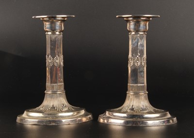 Lot 111 - A pair of Edward VII silver table candlesticks,...