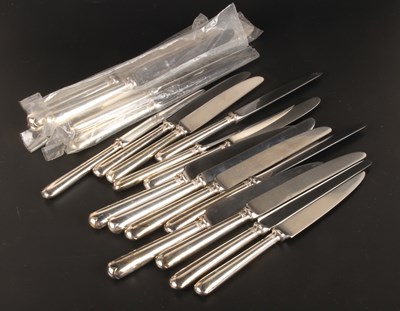 Lot 381 - Three sets of seven silver-handled knives